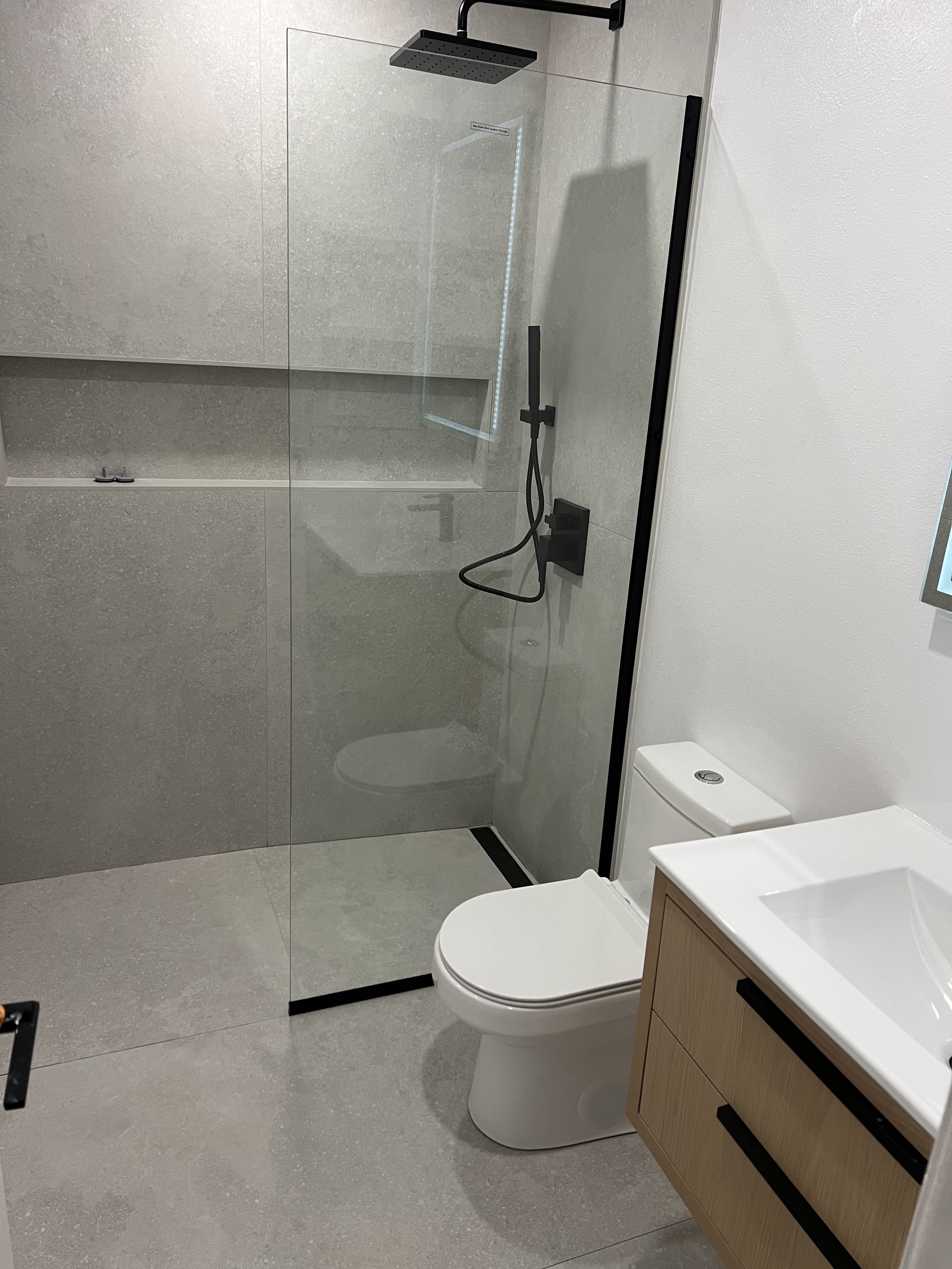 Bathroom remodel with walk-in shower and vanity